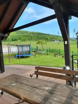 a park with a bench and a playground at Morycówka in Rzyki