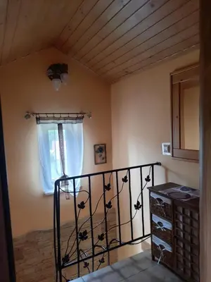 a room with a staircase and a window at Morycówka in Rzyki