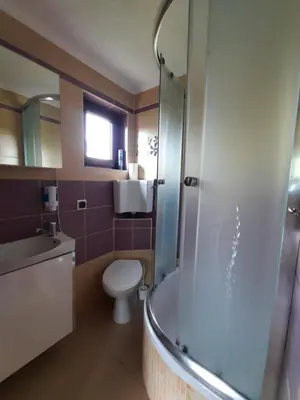a bathroom with a shower and a toilet and a sink at Morycówka in Rzyki