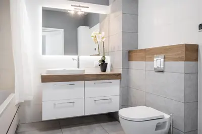 a bathroom with a toilet and a sink at Tauron Arena Residence WAWELOFTS in Kraków