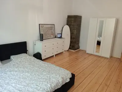 a bedroom with a bed and a dresser and a mirror at Apartament Central Station Batorego in Kraków