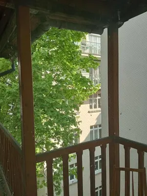 a view of a tree from a balcony at Apartament Central Station Batorego in Kraków