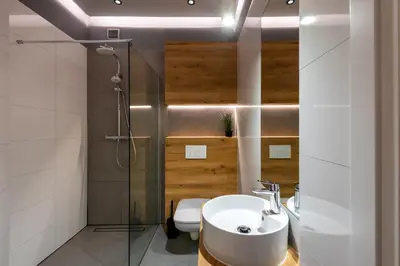 a bathroom with a sink and a shower and a toilet at St Florian Apartments in Kraków