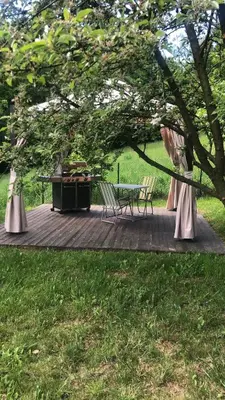 a small room with a table and a bed at Noclegi Bajama in Siepraw