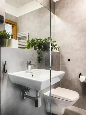 a bathroom with a sink and a toilet at Cozy apartment with AC for couples - Old Town in Kraków