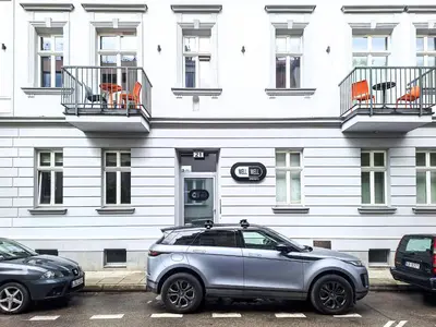 a silver suv parked in front of a building at Cozy apartment with AC for couples - Old Town in Kraków