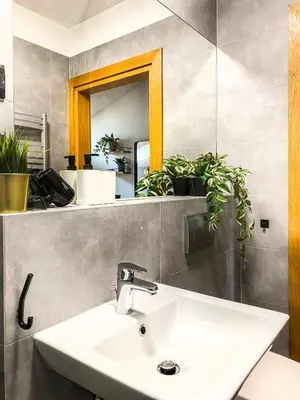 a bathroom with a sink and a mirror at Cozy apartment with AC for couples - Old Town in Kraków