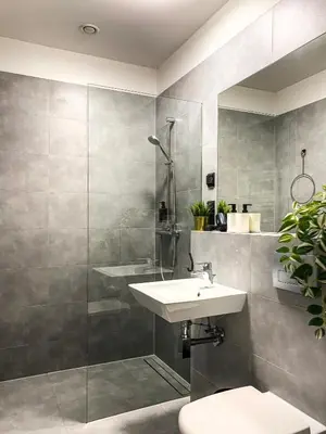 a bathroom with a sink and a shower at Cozy apartment with AC for couples - Old Town in Kraków