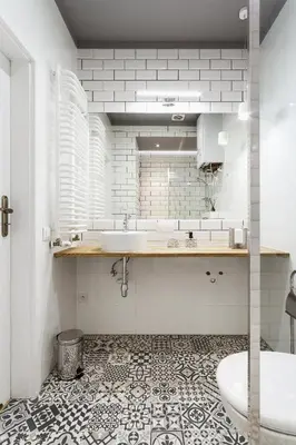 a white bathroom with a sink and a tub at Krakowska 16 Street Kazimierz District in Kraków