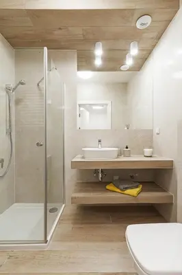 a bathroom with a shower and a sink and a toilet at Studio with balcony - Rajska 3 Street in Kraków
