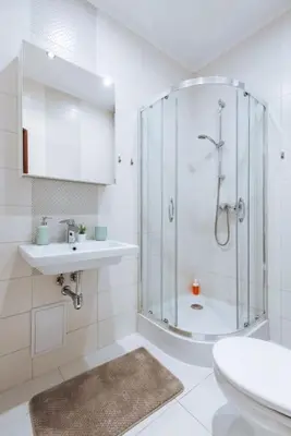 a bathroom with a shower and a sink and a toilet at Studio with balcony - Rzeszowska 4 Street in Kraków