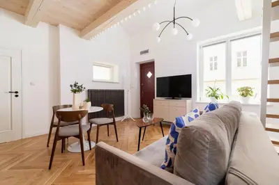 a living room with a couch and a table at Apartment with balcony - Rejtana 10 in Kraków
