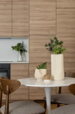a white table with two potted plants on it at Apartment with balcony - Rejtana 10 in Kraków