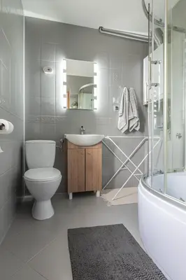 a bathroom with a toilet and a sink and a tub at Noclegi u Eweliny in Zator
