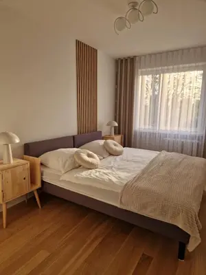 a bedroom with a large bed and a window at Moje miejsce Zator in Zator