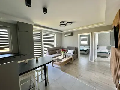 a living room with a couch and a table at Apartament Jasmin in Zator