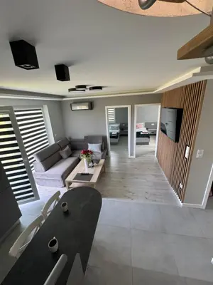 a living room with a couch and a table at Apartament Jasmin in Zator