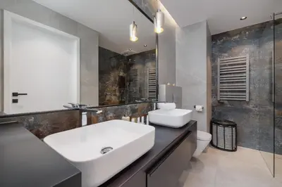 a bathroom with a sink and a toilet at Exclusive Apartment on the Vistula River in Kraków by Renters Prestige in Kraków