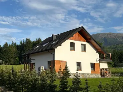 a house with a view of a mountain at Domek SAMI SWOI in Zawoja