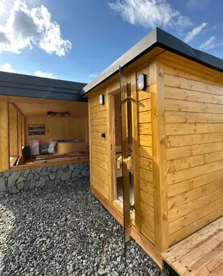 an inside view of a sauna with a window at Domek SAMI SWOI in Zawoja