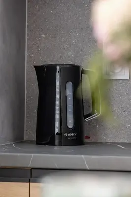 a black coffee pot sitting on top of a counter at Mogilska Apartments with Parking near TAURON Arena Kraków by Noclegi Renters in Kraków