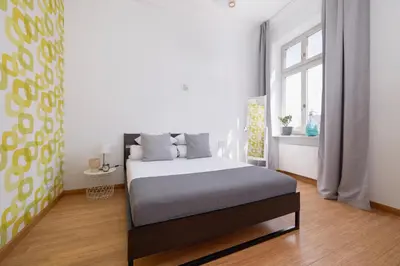 a bedroom with a bed and a window at 1-Bedroom Apartment - Brodzińskiego 3 - Podgórze in Kraków