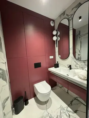 a bathroom with a white toilet and a sink at Penthouse21 in Oświęcim