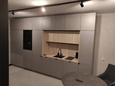 a kitchen with a sink and a table in a room at Wałowa Stylowe studio, AWG APARTMENTS in Kraków