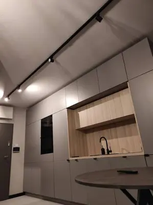 a kitchen with a table and a counter top at Wałowa Stylowe studio, AWG APARTMENTS in Kraków