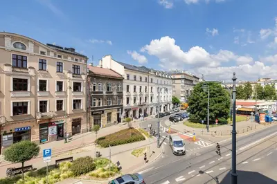 a view of a city street with cars and buildings at 1-Bedroom Apartment - 65 Długa Street in Kraków