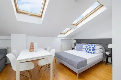 a bedroom with a bed and a table at Old Town - Apartment with AC - Długa 65 in Kraków