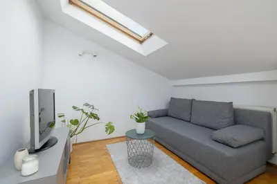 a living room with a couch and a tv at Old Town - Apartment with AC - Długa 65 in Kraków