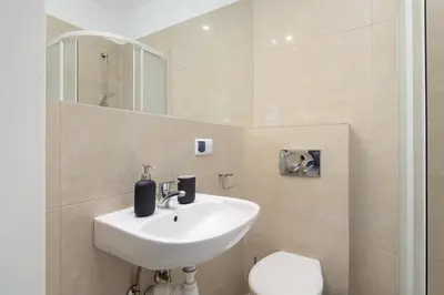 a bathroom with a sink and a toilet at Old Town - Apartment with AC - Długa 65 in Kraków