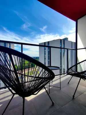 a balcony with two benches on a building at Movie Nights Tauron Arena in Kraków
