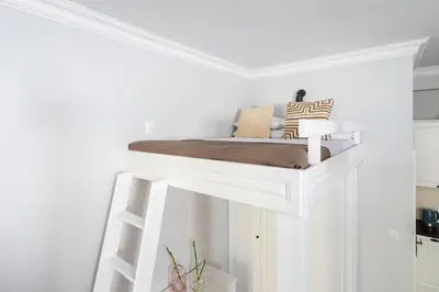 a room with a bed on top of a wall at Kazimierz District - Starowislna 43 in Kraków