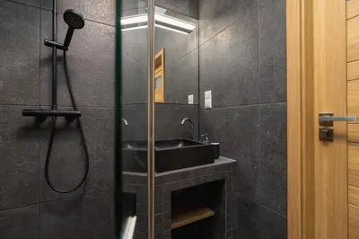 a bathroom with a sink and a shower at One bedroom apartment Kalwaryjska 34 street in Kraków