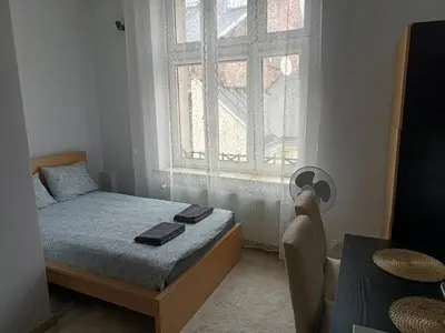 a small bedroom with a bed and a window at Apartment A4 In Downtown Of Krakow in Kraków