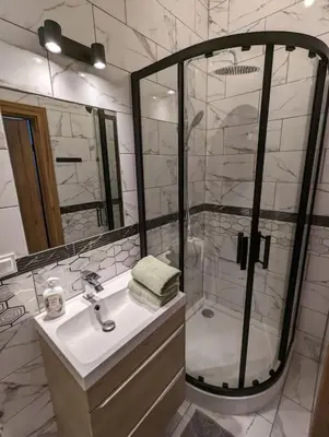 a bathroom with a shower and a sink and a shower at Apartment A4 In Downtown Of Krakow in Kraków