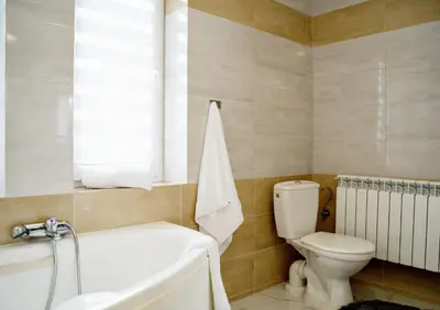 a bathroom with a washing machine and a sink at Magic Apartments - Garden in Zator