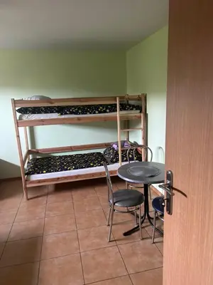 a room with a table and a table and chairs at Grojecka Ostoja in Grojec