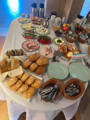a table with a bunch of different types of food at Grojecka Ostoja in Grojec