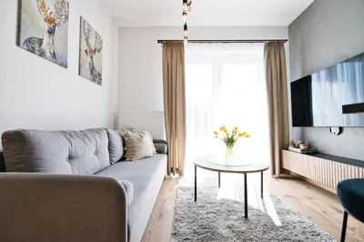 a living room with a couch and a table at Jaśminowa Ostoja Zator by Housine in Zator