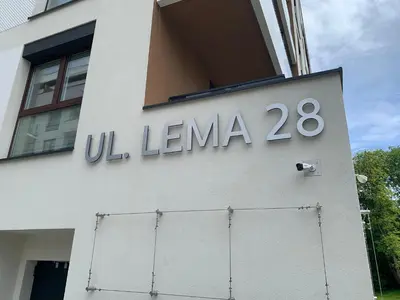 a sign on the side of a building at Apartment Krakow City-Arena in Kraków