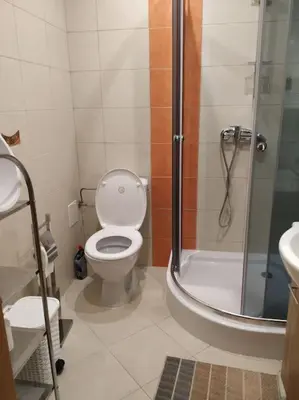 a bathroom with a shower and a toilet and a sink at Drewniany domek na wynajem Beskid Wyspowy in Limanowa