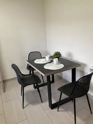 a table with two chairs and a table with two cups at Zaciszny zakątek pod Różą in Skawinki