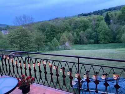 a group of people sitting on a balcony at Zaciszny zakątek pod Różą in Skawinki