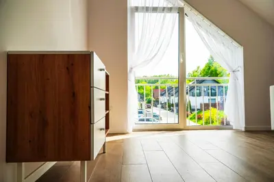 a dresser in a room with a large window at Dom obok lasu pod Krakowem in Zabierzów