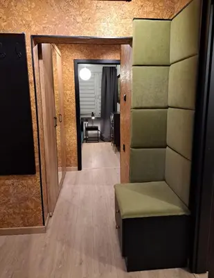 two beds in a room with a window at Green Apartament in Oświęcim