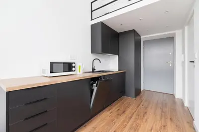 a kitchen with a counter top with a microwave at Kazimierz District - 43 Starowislna Street in Kraków