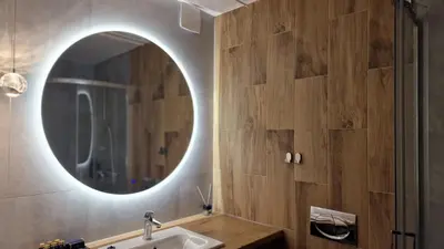 a bathroom with a sink and a washing machine and towels at Alibi - Sympozjum Studio in Kraków